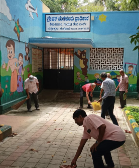 Members cleaning the premises of the Association office during a Swachhata drive